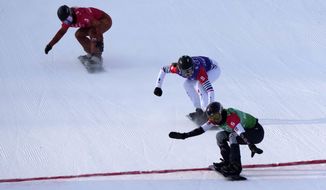 United States&#39; Lindsey Jacobellis (5), followed by France&#39;s Chloe Trespeuch (8) and Canada&#39;s Meryeta O&#39;Dine (3) crosses the finish line to win a gold medal during the women&#39;s cross final at the 2022 Winter Olympics, Wednesday, Feb. 9, 2022, in Zhangjiakou, China. (AP Photo/Lee Jin-man)