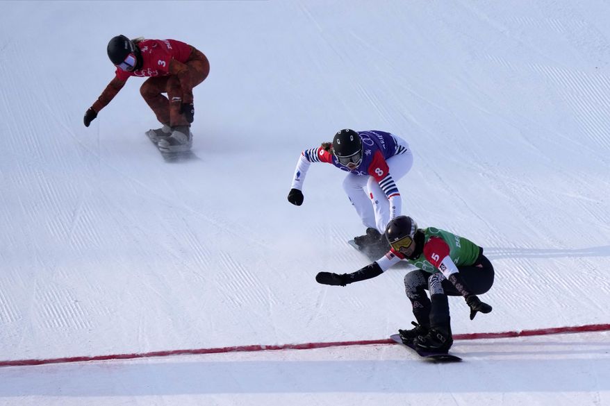 United States&#x27; Lindsey Jacobellis (5), followed by France&#x27;s Chloe Trespeuch (8) and Canada&#x27;s Meryeta O&#x27;Dine (3) crosses the finish line to win a gold medal during the women&#x27;s cross final at the 2022 Winter Olympics, Wednesday, Feb. 9, 2022, in Zhangjiakou, China. (AP Photo/Lee Jin-man)