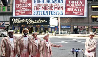 Jefferson Mays, right, as River City&#39;s Mayor George Shinn, and the musical&#39;s barbershop quartet kick off the opening week of Broadway&#39;s &#39;The Music Man&#39; outside the Winter Garden Theatre on Tuesday, Feb. 8, 2022, in New York. (Photo by Charles Sykes/Invision/AP)