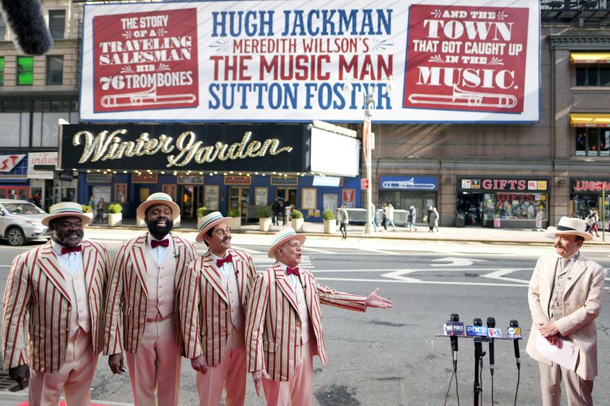 Jefferson Mays, right, as River City's Mayor George Shinn, and the musical's barbershop quartet kick off the opening week of Broadway's 'The Music Man' outside the Winter Garden Theatre on Tuesday, Feb. 8, 2022, in New York. (Photo by Charles Sykes/Invision/AP)