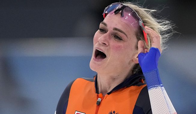 Irene Schouten of the Netherlands reacts after wining the gold medal and setting an Olympic record in the women&#x27;s speedskating 5,000-meter race at the 2022 Winter Olympics, Thursday, Feb. 10, 2022, in Beijing. (AP Photo/Sue Ogrocki)