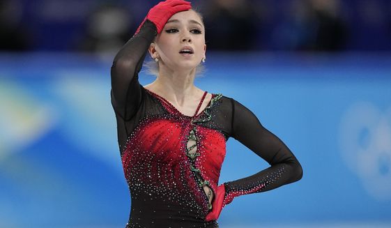 Kamila Valieva, of the Russian Olympic Committee, reacts in the women&#39;s team free skate program during the figure skating competition at the 2022 Winter Olympics, Monday, Feb. 7, 2022, in Beijing. Valieva is at the center of the biggest doping story of the Beijing Games after the Russian newspaper RBC reported that the figure skater tested positive for a banned heart medication before the Olympics. Russian athletes are in Beijing competing as the &amp;quot;Russian Olympic Committee&amp;quot; (ROC), after the country was banned because of a massive state-sponsored doping scheme at the Sochi Games in 2014. (AP Photo/David J. Phillip)