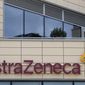 FILE - A general view of AstraZeneca offices and the corporate logo in Cambridge, England, Saturday, July 18, 2020. AstraZeneca has recorded a big jump in revenue as it begins to take a profit from its coronavirus vaccine for the first time. The company recorded full-year revenues of $37.4 billion, an increase of 38% from the year before at constant exchange rates. Part of the boost came from $4 billion in sales of its COVID-19 vaccine, developed with the University of Oxford. Despite rising revenue, AstraZeneca reported a pre-tax loss of $265 million due to costs from its purchase of U.S. drug company Alexion Pharmaceuticals and new drug research. (AP Photo/Alastair Grant, File)