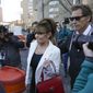 Sarah Palin is escorted to her car by Ron Duguay after leaving the courthouse in New York, Thursday, Feb. 10, 2022. Former Alaska Gov. Sarah Palin told a jury Thursday she felt like she was at the mercy of a “Goliath” when she first learned a 2017 New York Times editorial suggested her campaign rhetoric helped incite a mass shooting.(AP Photo/Seth Wenig)