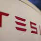 The logo for the Tesla Supercharger station is seen in Buford, Ga, April 22, 2021,. Tesla is recalling nearly 579,000 vehicles in the U.S. because sounds played over an external speaker can obscure audible warnings for pedestrians. The recall is the fourth made public in the last two weeks as U.S. safety regulators increase scrutiny of the nation’s largest electric vehicle maker. (AP Photo/Chris Carlson, File)