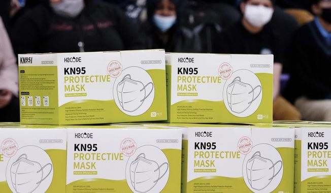 Shown are KN95 protective masks before being distributed to students at Camden High School in Camden, N.J., Wednesday, Feb. 9, 2022. As the omicron wave of the coronavirus subsides, several U.S. states including New York and Illinois ended mask mandates this week for indoor settings, while others lifted requirements at schools.  (AP Photo/Matt Rourke)