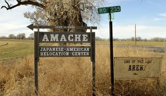 A sign stands at the entrance to Camp Amache, on Jan. 18, 2015, the site of a former World War II-era, Japanese American internment camp, in Granada, Colo. (AP Photo/Russell Contreras, File)