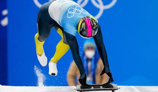 Vladyslav Heraskevych, of Ukraine, starts the men&#39;s skeleton run 3 at the 2022 Winter Olympics, Friday, Feb. 11, 2022, in the Yanqing district of Beijing. (AP Photo/Mark Schiefelbein)