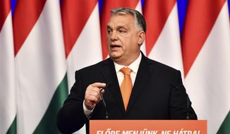 Viktor Orban delivers his annual state of the nation speech in Varkert Bazaar conference hall of Budapest, Hungary, Saturday, Feb 12, 2022. He is preparing with his right-wing party FIDESZ for the upcoming elections on April 3. (AP Photo/Anna Szilagyi)