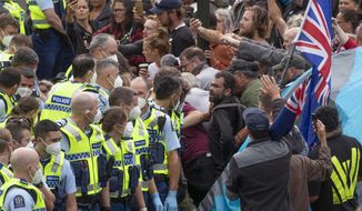 Police arrest people protesting against coronavirus mandates at Parliament in Wellington, New Zealand, on Feb. 10, 2022. Some countries might send in a riot squad to disperse trespassing protesters. In New Zealand, authorities turned on the sprinklers and Barry Manilow. But the moves to try and flush out several hundred protesters who have been camped on Parliament&#39;s grassy grounds since Tuesday, Feb. 8, had little effect.  (Mark Mitchell/NZ Herald via AP, File)