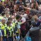 Police arrest people protesting against coronavirus mandates at Parliament in Wellington, New Zealand, on Feb. 10, 2022. Some countries might send in a riot squad to disperse trespassing protesters. In New Zealand, authorities turned on the sprinklers and Barry Manilow. But the moves to try and flush out several hundred protesters who have been camped on Parliament&#39;s grassy grounds since Tuesday, Feb. 8, had little effect.  (Mark Mitchell/NZ Herald via AP, File)