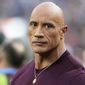 Dwayne &amp;quot;The Rock&amp;quot; Johnson stands on the field before the NFL Super Bowl 56 football game between the Los Angeles Rams and the Cincinnati Bengals, Sunday, Feb. 13, 2022, in Inglewood, Calif. (AP Photo/Chris O&#x27;Meara)