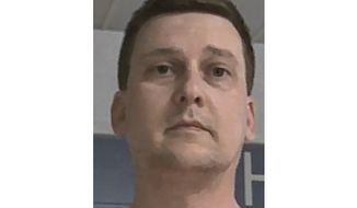 This booking photo released Oct. 9, 2021, by the West Virginia Regional Jail and Correctional Facility Authority shows Jonathan Toebbe. Toebbe has pleaded guilty to trying to pass information about American nuclear-powered warships to a foreign country. Toebbe pleaded guilty in federal court in Martinsburg, W.Va., to a single count of conspiracy to communicate restricted data. (West Virginia Regional Jail and Correctional Facility Authority via AP)