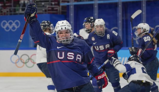 United States&#x27; Cayla Barnes (3) celebrates after scoring a goal against Finland during a women&#x27;s semifinal hockey game at the 2022 Winter Olympics, Monday, Feb. 14, 2022, in Beijing. (AP Photo/Petr David Josek)