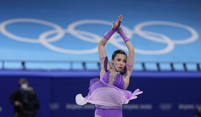 Kamila Valieva, of the Russian Olympic Committee, competes in the women&#x27;s short program during the figure skating at the 2022 Winter Olympics, Tuesday, Feb. 15, 2022, in Beijing. (AP Photo/David J. Phillip)