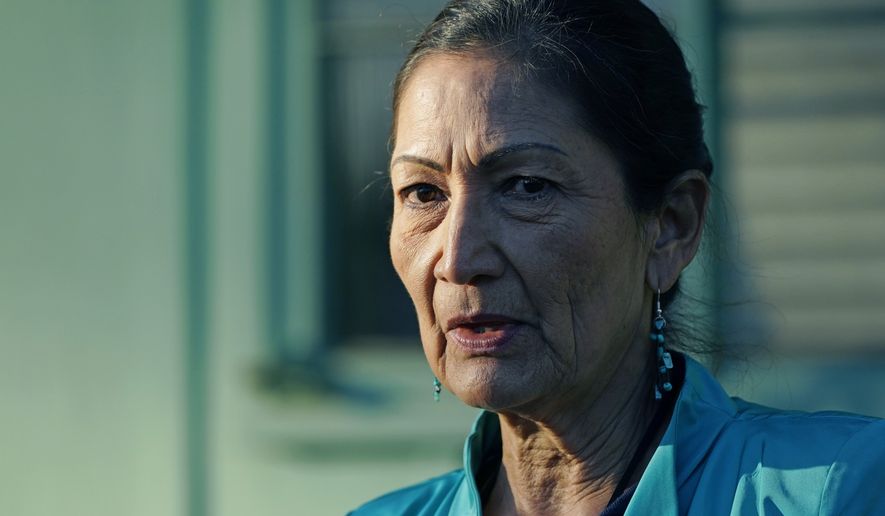 Secretary of the Interior Deb Haaland speaks with reporters about visiting several communities and sites in Mississippi to honor individuals and events that advanced the Civil Rights Movement, while standing outside the Medgar and Myrlie Evers Home National Monument in Jackson, Miss., Tuesday, Feb. 15, 2022. (AP Photo/Rogelio V. Solis)