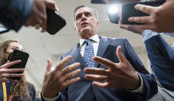 Sen. Mitt Romney, R-Utah, talks to reporters during votes, at the Capitol in Washington, Tuesday, Feb. 15, 2022. (AP Photo/J. Scott Applewhite)