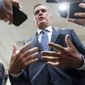 Sen. Mitt Romney, R-Utah, talks to reporters during votes, at the Capitol in Washington, Tuesday, Feb. 15, 2022. (AP Photo/J. Scott Applewhite)
