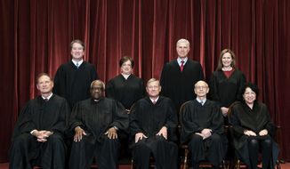 Members of the Supreme Court pose for a group photo at the Supreme Court in Washington, April 23, 2021. Seated from left are Associate Justice Samuel Alito, Associate Justice Clarence Thomas, Chief Justice John Roberts, Associate Justice Stephen Breyer and Associate Justice Sonia Sotomayor, Standing from left are Associate Justice Brett Kavanaugh, Associate Justice Elena Kagan, Associate Justice Neil Gorsuch and Associate Justice Amy Coney Barrett.  (Erin Schaff/The New York Times via AP, Pool)  **FILE**
