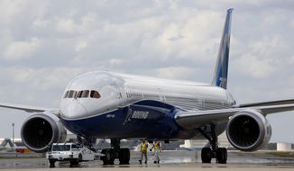 In this Friday, March 31, 2017, file photo, Boeing employees walk the new Boeing 787-10 Dreamliner down towards the delivery ramp area at the company&#39;s facility in South Carolina after conducting its first test flight at Charleston International Airport in North Charleston, S.C. Federal safety officials aren&#39;t ready to give back authority for approving new planes to Boeing when it comes to the large 787 jet, which Boeing calls the Dreamliner, Tuesday, Feb. 15, 2022. The plane has been plagued by production flaws for more than a year.(AP Photo/Mic Smith, File)