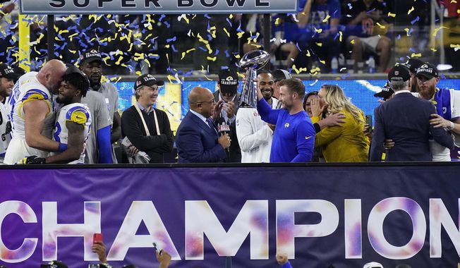 Los Angeles Rams head coach Sean McVay holds the Lombardi Trophy after the NFL Super Bowl 56 football game Sunday, Feb. 13, 2022, in Inglewood, Calif. The Rams defeated the Cincinnati Bengals 23-20. (AP Photo/Ted S. Warren)
