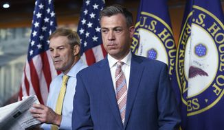 Rep. Jim Banks, R-Ind., right, and Rep. Jim Jordan, R-Ohio, left, exchange places at the podium during a news conference at the Capitol in Washington, Wednesday, July 21, 2021. Banks, who was rejected by House Speaker Nancy Pelosi as the top Republican for the committee investigating last year&#39;s U.S. Capitol insurrection is fending off an effort to remove his name from this year&#39;s election ballot. (AP Photo/J. Scott Applewhite, File)