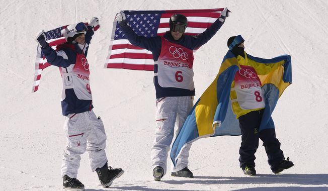 From left silver medal winner United State&#x27;s Nick Goepper, gold medal winner United States&#x27; Alexander Hall and bronze medal winner Sweden&#x27;s Jesper Tjader celebrate afrter the men&#x27;s slopestyle finals at the 2022 Winter Olympics, Wednesday, Feb. 16, 2022, in Zhangjiakou, China. (AP Photo/Francisco Seco)