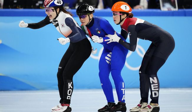 Choi Min-jeong, left, of South Korea, crosses the finish line ahead of Arianna Fontana of Italy, Suzanne Schulting, right, of the Netherlands, in the women&#x27;s 1500-meters final during the short track speedskating competition at the 2022 Winter Olympics, Wednesday, Feb. 16, 2022, in Beijing. (AP Photo/Bernat Armangue)