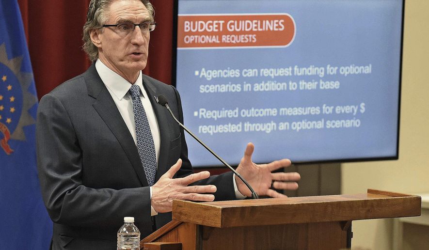 North Dakota Governor Doug Burgum speaks at a press briefing on May 1, 2020 at the state capitol in Bismarck, N.D.. Gov. Burgum is expected to highlight the state&#39;s economy and remaining challenges of the pandemic in his State of the State address on Wednesday Feb. 16, 2022. (Tom Stromme/The Bismarck Tribune via AP File)
