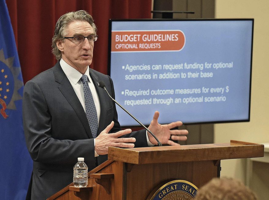North Dakota Governor Doug Burgum speaks at a press briefing on May 1, 2020 at the state capitol in Bismarck, N.D.. Gov. Burgum is expected to highlight the state's economy and remaining challenges of the pandemic in his State of the State address on Wednesday Feb. 16, 2022. (Tom Stromme/The Bismarck Tribune via AP File)