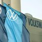 Company logo flags wave in front of a Volkswagen factory building in Zwickau, Germany, on April 23, 2020. (AP Photo/Jens Meyer, File)