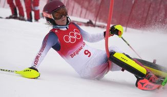 Mikaela Shiffrin of the United States crashes out during the women&#39;s combined slalom at the 2022 Winter Olympics, Thursday, Feb. 17, 2022, in the Yanqing district of Beijing. (AP Photo/Robert F. Bukaty)