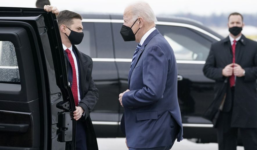 President Joe Biden gets into his motorcade upon arrival at Cleveland Hopkins International Airport, Thursday, Feb. 17, 2022, in Cleveland. (AP Photo/Alex Brandon)