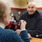 Democratic candidate for the Pennsylvania U.S. Senate seat in the 2022 primary election, Lt. Gov. John Fetterman, right, talks with Elisabeth Fulmer during a campaign stop at the Mechanistic Brewery, in Clarion, Pa., Saturday, Feb. 12, 2022. (AP Photo/Keith Srakocic)