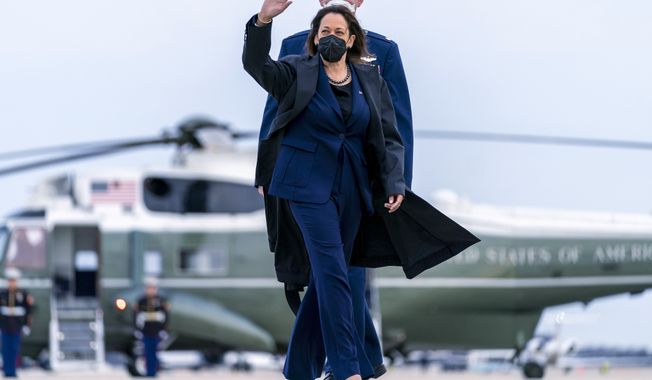 Vice President Kamala Harris, escorted by Maj Guy Evertson, Alt. Director Flight Line Protocol, C-32A Pilot, walks across the tarmac to board her plane at Andrews Air Force Base, Md., Thursday, Feb. 17, 2022, to travel to Munich for the Munich Security Conference. (AP Photo/Andrew Harnik, Pool)