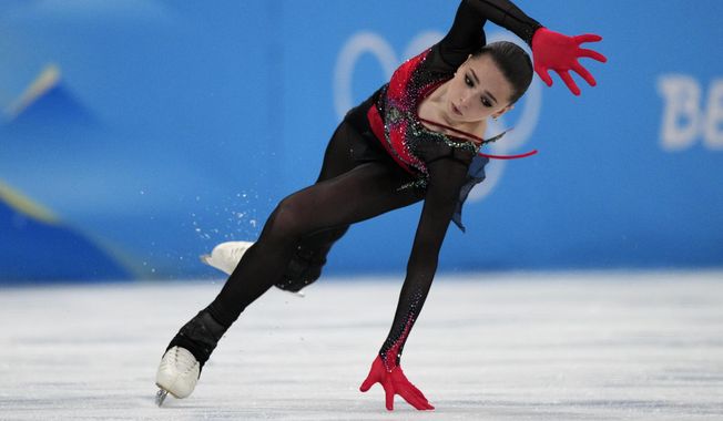 Kamila Valieva, of the Russian Olympic Committee, falls in the women&#x27;s free skate program during the figure skating competition at the 2022 Winter Olympics, Thursday, Feb. 17, 2022, in Beijing. (AP Photo/Bernat Armangue)