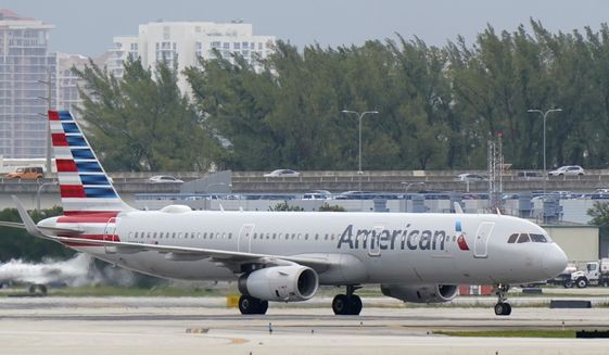 An American Airlines Airbus A321-231 taxies to the gate, Tuesday, Oct. 20, 2020, at Fort Lauderdale-Hollywood International Airport in Fort Lauderdale, Fla. (AP Photo/Wilfredo Lee, File)
