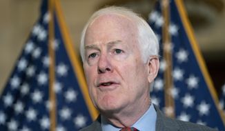 Sen. John Cornyn, R-Texas, speaks to the media Feb., 2, 2022, on Capitol Hill in Washington. Federal judges would have to publicly disclose more about their finances under a bill approved by the Senate this week. The bipartisan bill by Cornyn and Sen. Chris Coons, D-Del., is intended to make it easier for the public to find out if a judge&#39;s financial holdings could pose a conflict of interest in a case they are presiding over. (AP Photo/Jacquelyn Martin, File)