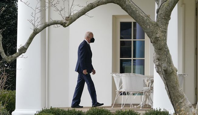 President Joe Biden walks to the Oval Office of the White House after stepping off Marine One, Thursday, Feb. 17, 2022, in Washington. Biden is returning to Washington after traveling to Ohio to promote his infrastructure agenda. (AP Photo/Patrick Semansky)