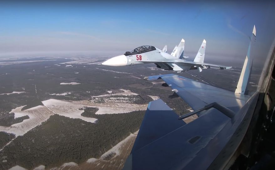 In this photo taken from video provided by the Russian Defense Ministry Press Service on Thursday, Feb. 17, 2022, Su-30 fighters of the Russian and Belarusian air forces fly in a joint mission during the Union Courage-2022 Russia-Belarus military drills in Belarus. (Russian Defense Ministry Press Service via AP) ** FILE **