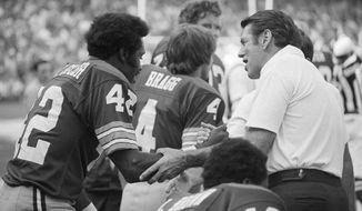 FILE - Washington Redskins wide receiver Charley Taylor (42) is congratulated by coach George Allen during the NFL football team&#x27;s game against the New York Giants in Washington on Sept. 28, 1975, after it was announced the Taylor had surpassed 10,000 total yards in his career. Taylor, the Hall of Fame receiver who ended his 13-season career with Washington as the NFL&#x27;s career receptions leader, died Saturday, Feb. 19, 2022. He was 80. The Commanders said Taylor died at an assisted-living facility in Northern Virginia. The cause of death wasn&#x27;t announced. (AP Photo/Charles Bennett, File)