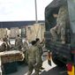 U.S. troops load equipment onto vehicles in Rzeszow, Poland, on Saturday, Feb. 19, 2022. The U.S. has recently sent nearly 5,000 troops to NATO ally Poland, in addition to the 4,000 that are on a permanent rotation in Poland. (AP Photo/Czarek Sokolowski) ** FILE **
