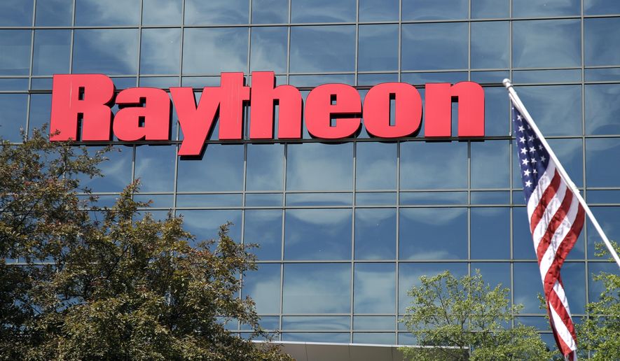 An American flag flies in front of the facade of Raytheon&#39;s Integrated Defense Systems facility, in Woburn, Mass on June 10, 2019. China said Monday, Feb. 21, 2022, it will impose new sanctions on U.S. defense contractors Raytheon Technologies and Lockheed Martin due to their arms sales to Taiwan, stepping up a feud with Washington over security and Beijing’s strategic ambitions. (AP Photo/Elise Amendola, File)