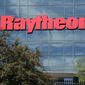 An American flag flies in front of the facade of Raytheon&#39;s Integrated Defense Systems facility, in Woburn, Mass on June 10, 2019. China said Monday, Feb. 21, 2022, it will impose new sanctions on U.S. defense contractors Raytheon Technologies and Lockheed Martin due to their arms sales to Taiwan, stepping up a feud with Washington over security and Beijing’s strategic ambitions. (AP Photo/Elise Amendola, File)