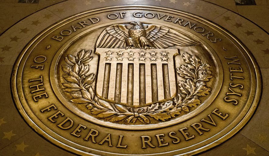 In this Feb. 5, 2018, file photo, the seal of the Board of Governors of the United States Federal Reserve System is displayed in the ground at the Marriner S. Eccles Federal Reserve Board Building in Washington. Federal Reserve Governor Michelle Bowman said Monday, Feb. 21, 2022, that she was open to lifting interest rates by more than the traditional quarter-point at the central bank&#x27;s next meeting in March. (AP Photo/Andrew Harnik, File)