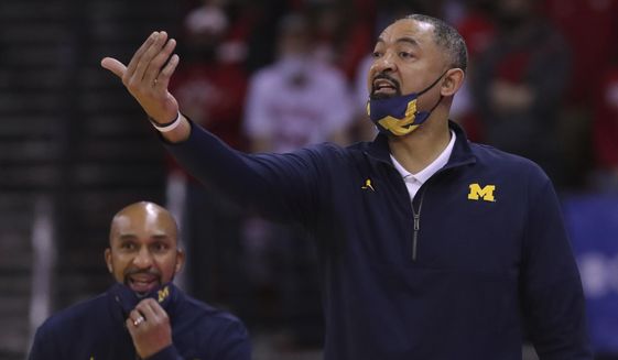 Michigan head coach Juwan Howard reacts during the first half of an NCAA college basketball game against Wisconsin, Sunday, Feb. 20, 2022, in Madison, Wis. (Mark Hoffman/Milwaukee Journal-Sentinel via AP) **FILE**