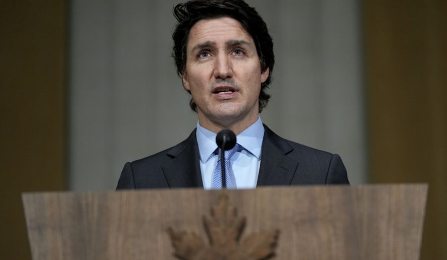 Prime Minister Justin Trudeau speaks on the situation in Ukraine, in Ottawa, on Tuesday, Feb. 22, 2022. Trudeau says Canada is sending hundreds more troops to eastern Europe and imposing new sanctions on Russia in response to the deployment of forces into Ukraine. (Justin Tang/The Canadian Press via AP)