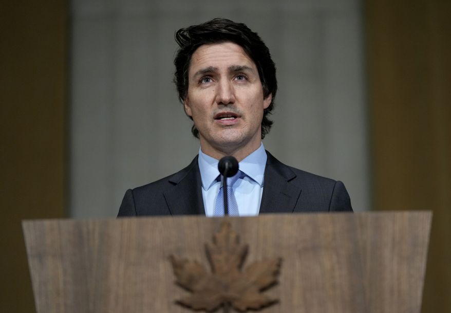 Prime Minister Justin Trudeau speaks on the situation in Ukraine, in Ottawa, on Tuesday, Feb. 22, 2022. Trudeau says Canada is sending hundreds more troops to eastern Europe and imposing new sanctions on Russia in response to the deployment of forces into Ukraine. (Justin Tang/The Canadian Press via AP)