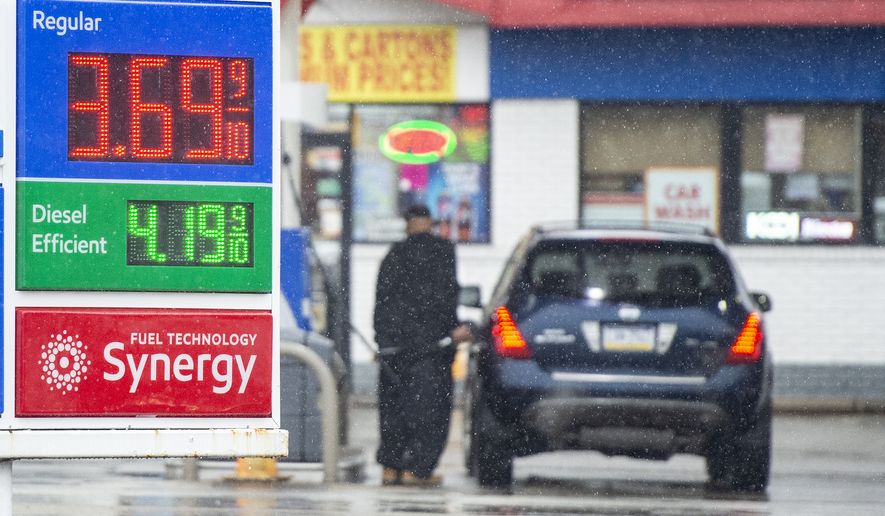 The high price of gas displayed on an Exxon gas station marquee at the corner of Allegheny River Boulevard and Sandy Creek Road Thursday, Feb. 17, 2022 in Penn Hills, Pa. U.S. consumer confidence declined modestly this month but remains high, even as prices for just about everything continue to rise. (Pam Panchak/Pittsburgh Post-Gazette via AP)