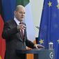 German Chancellor Olaf Scholz addresses a joint press conference with Ireland&#39;s Prime Minister following talks at the Chancellery in Berlin on February 22, 2022. (John MACDOUGALL /Pool Photo via AP)